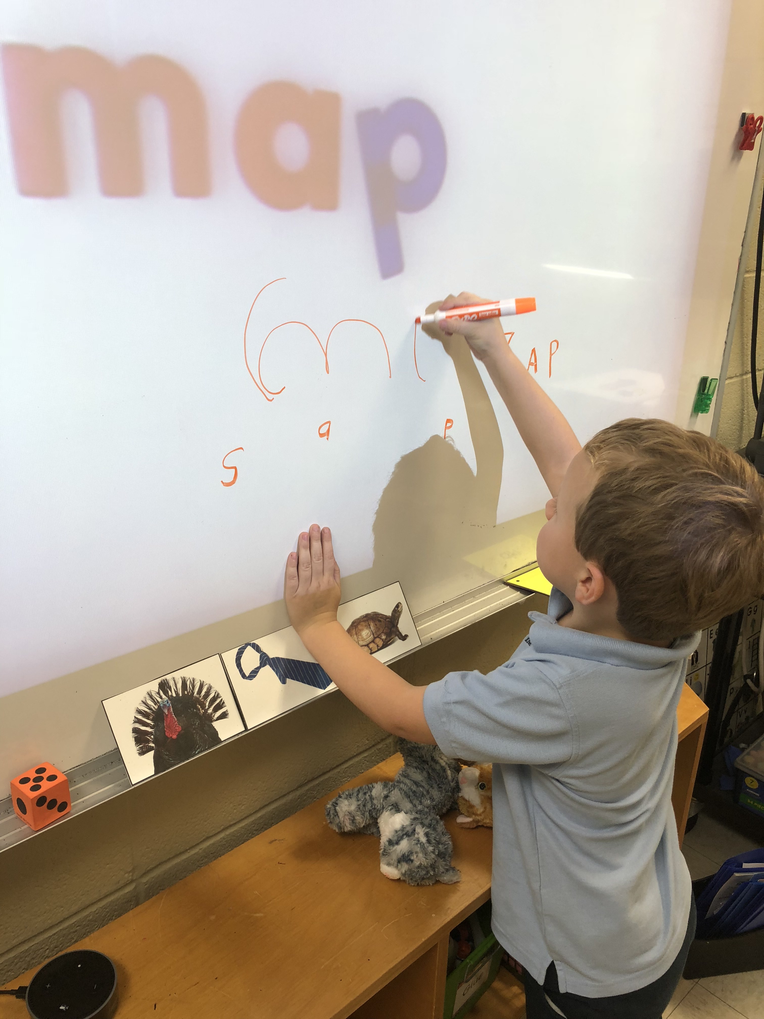 A little kid doing writing excersices