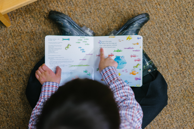 photo of student reading a book