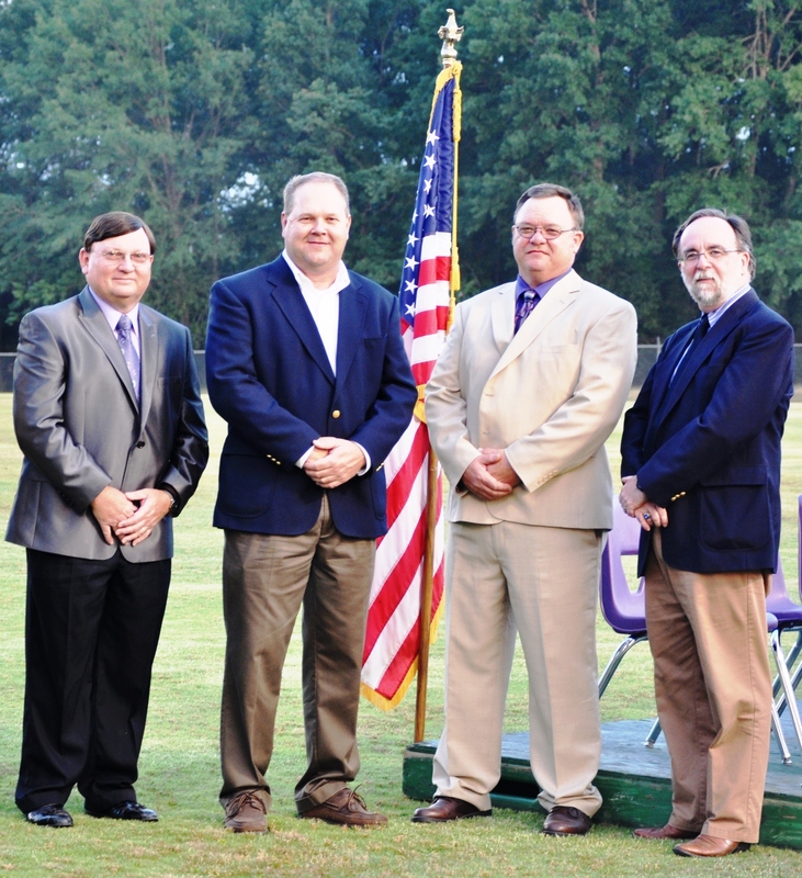 School Board in front of the US Flag