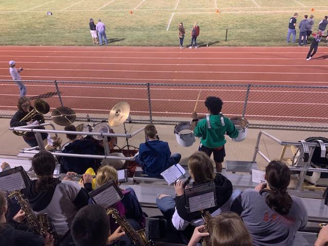 A photo of the football field along with a couple of spectators.