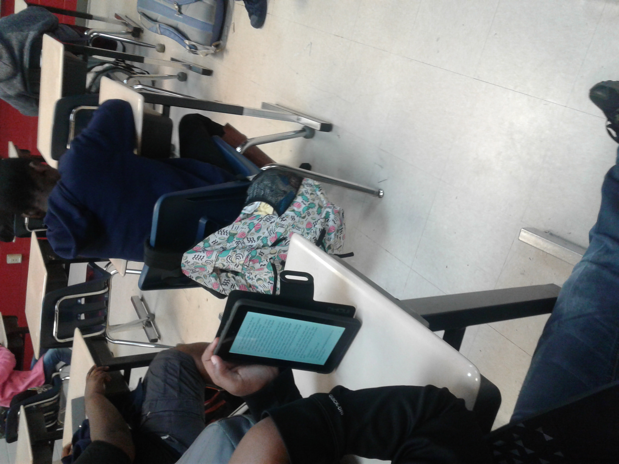Photo of student using technology at class.