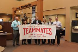 Teammates holding banner