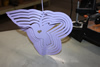 A lilac hummingbird wind spinner