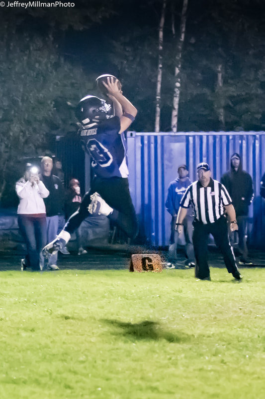 jumping to catch football
