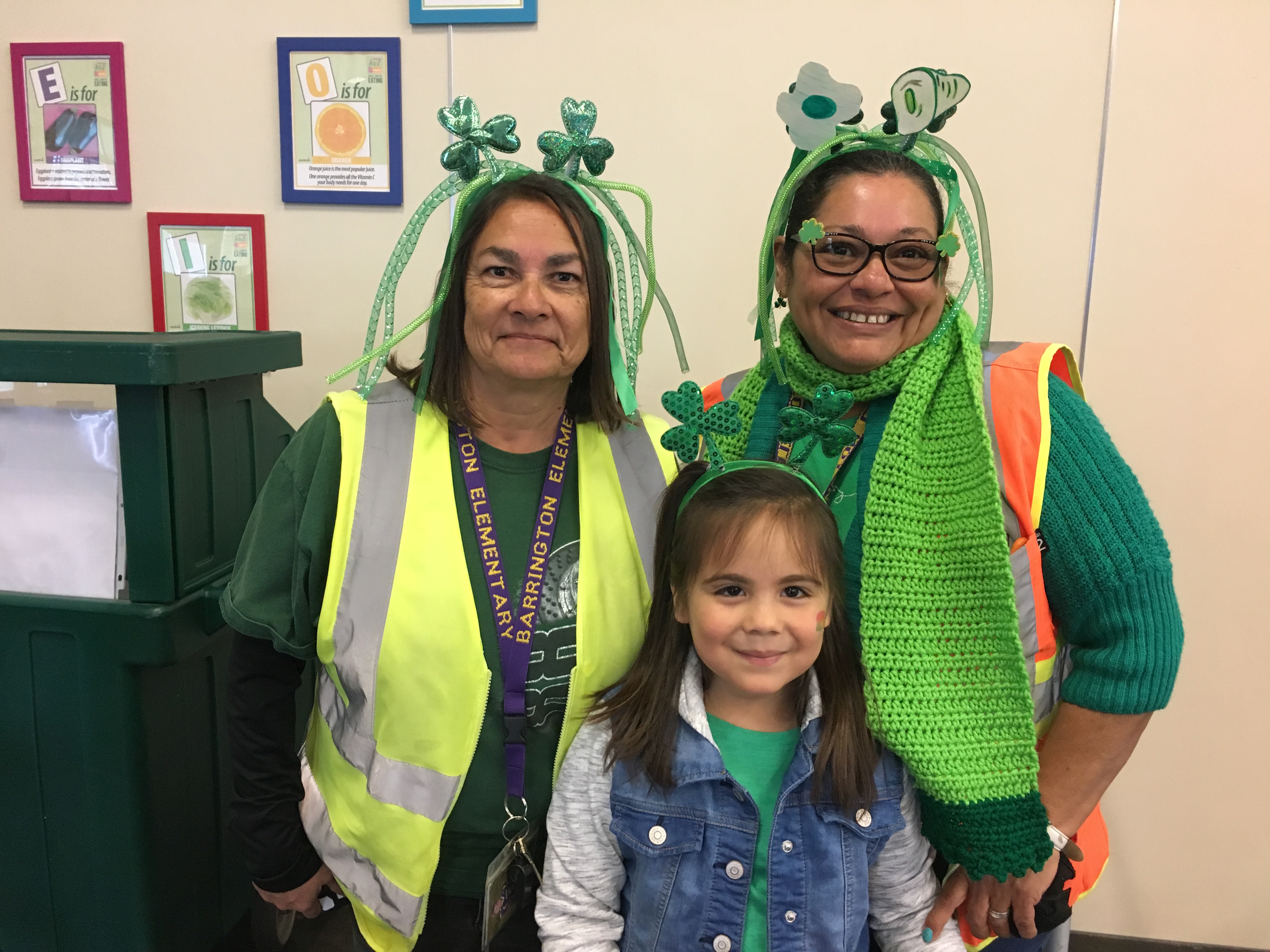 Students and teachers all wearing a green piece of clothing
