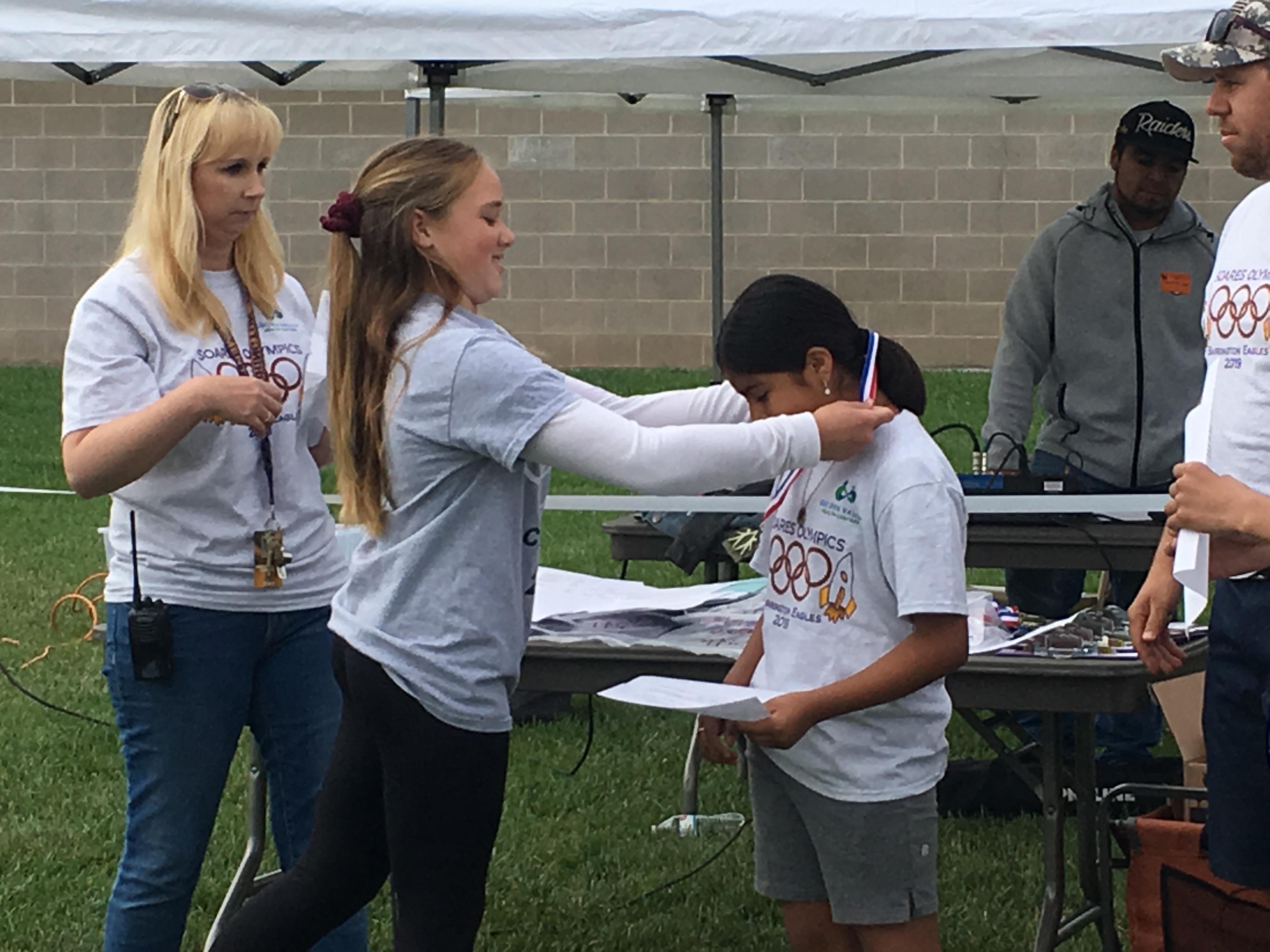 The students all enjoying different activities during their Mini-Olympics