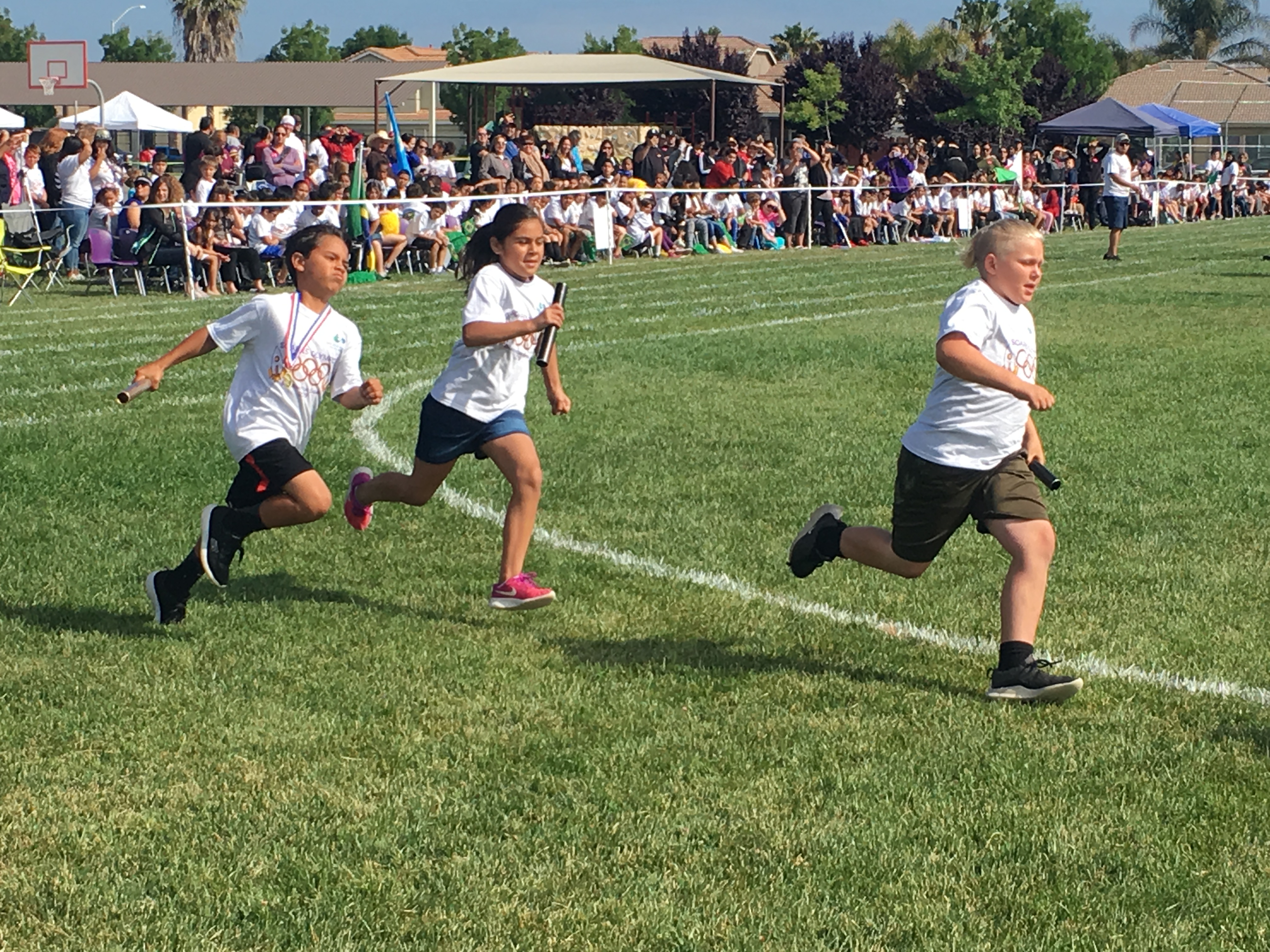 The students all enjoying different activities during their Mini-Olympics