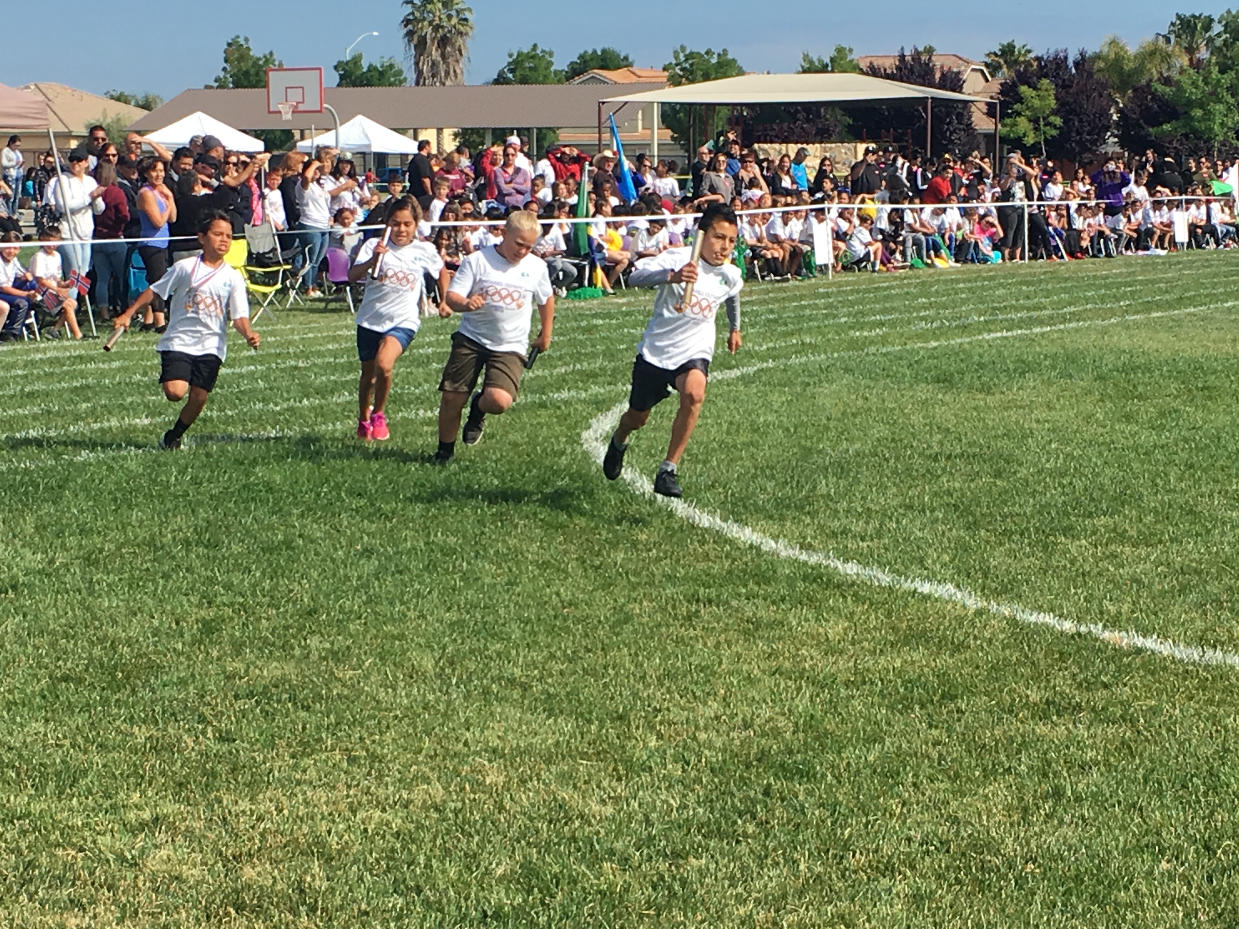 The students all enjoying different activities during their Mini-Olympics