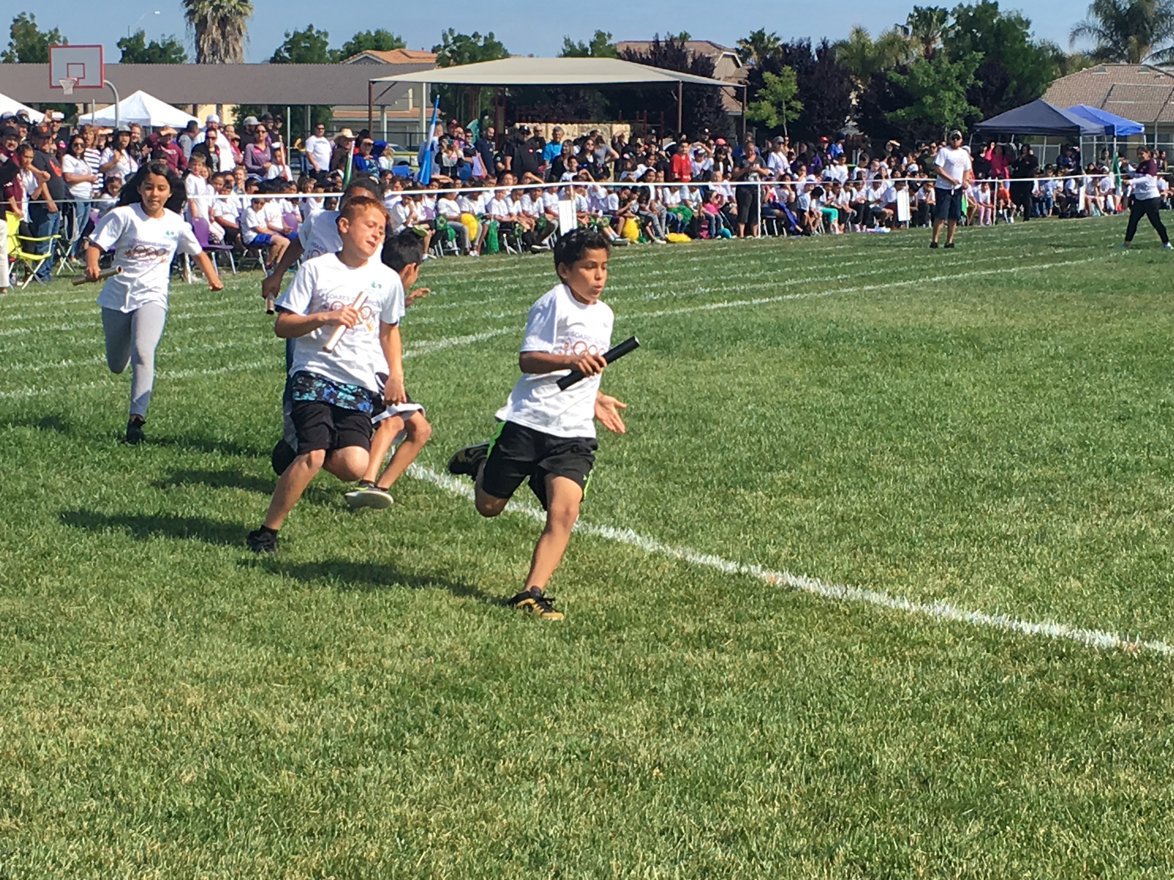 The students all enjoying different activities during their Mini-Olympics