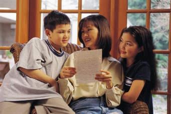 A stock photo of a mother and her two children