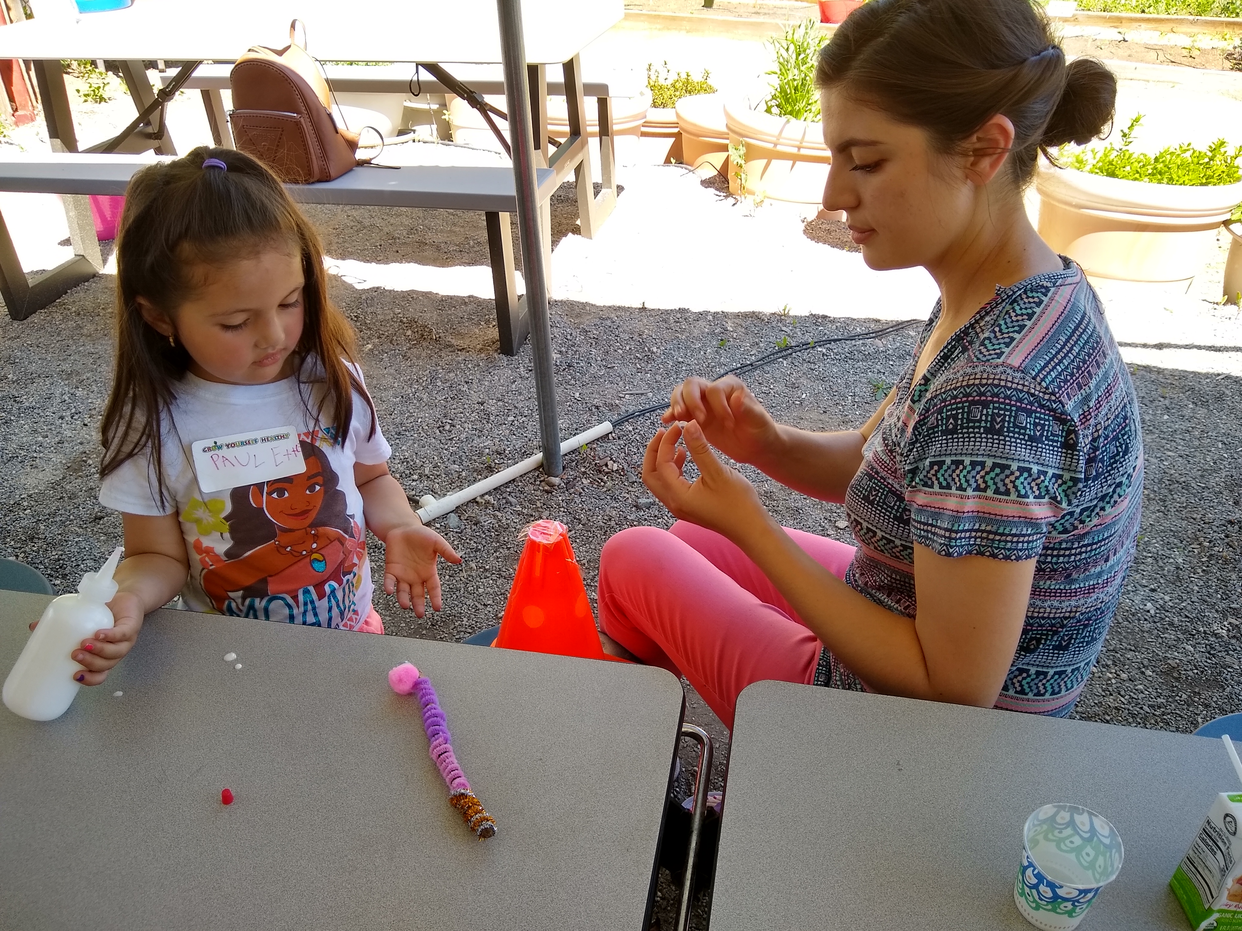 student and teacher painting