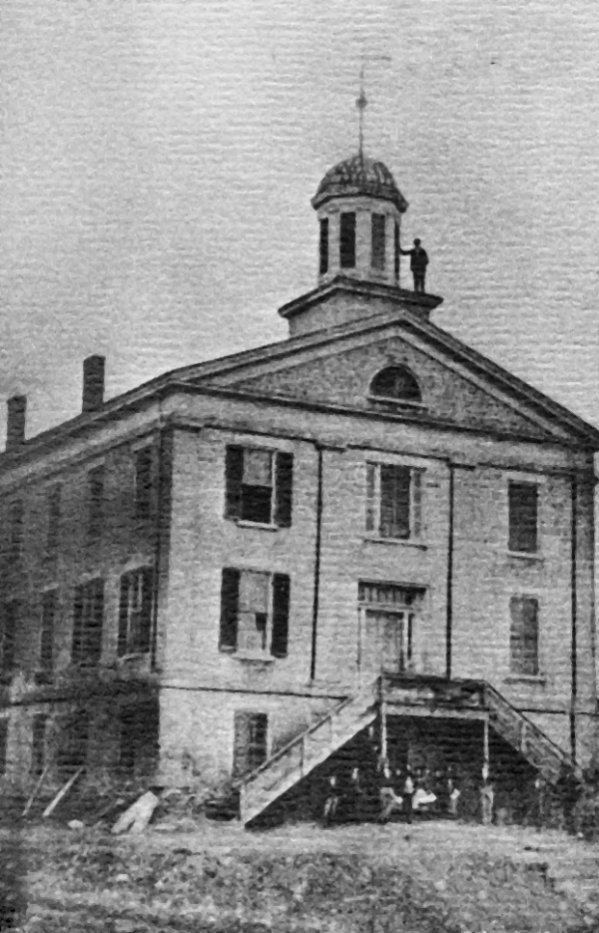 Black and white photo of the school's building.