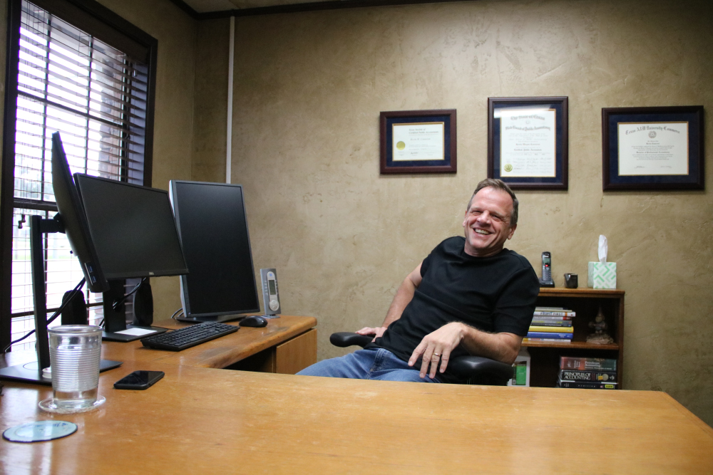 Kevin Cameron Sitting at desk