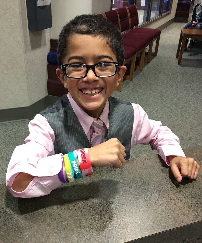 photo of student with multiple bracelets on