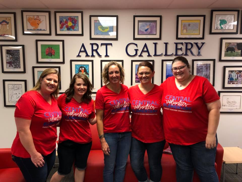 photo of volunteers in front of the student art gallery