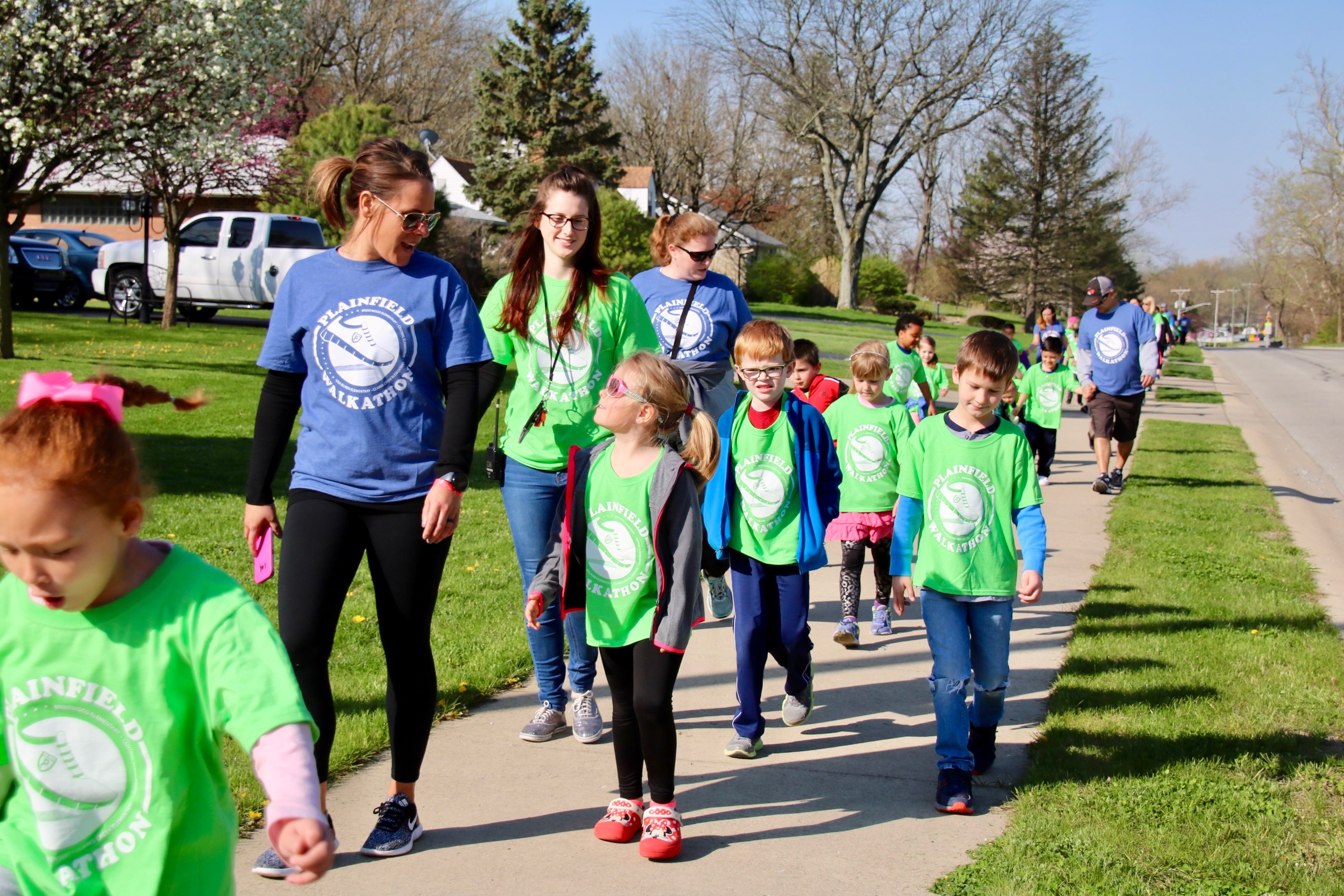 photo of volunteers with students
