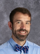 A photo of Principal Adam Raby.