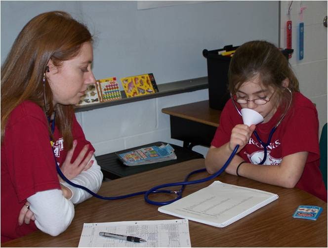 Photo of a speech pathologist working with a student