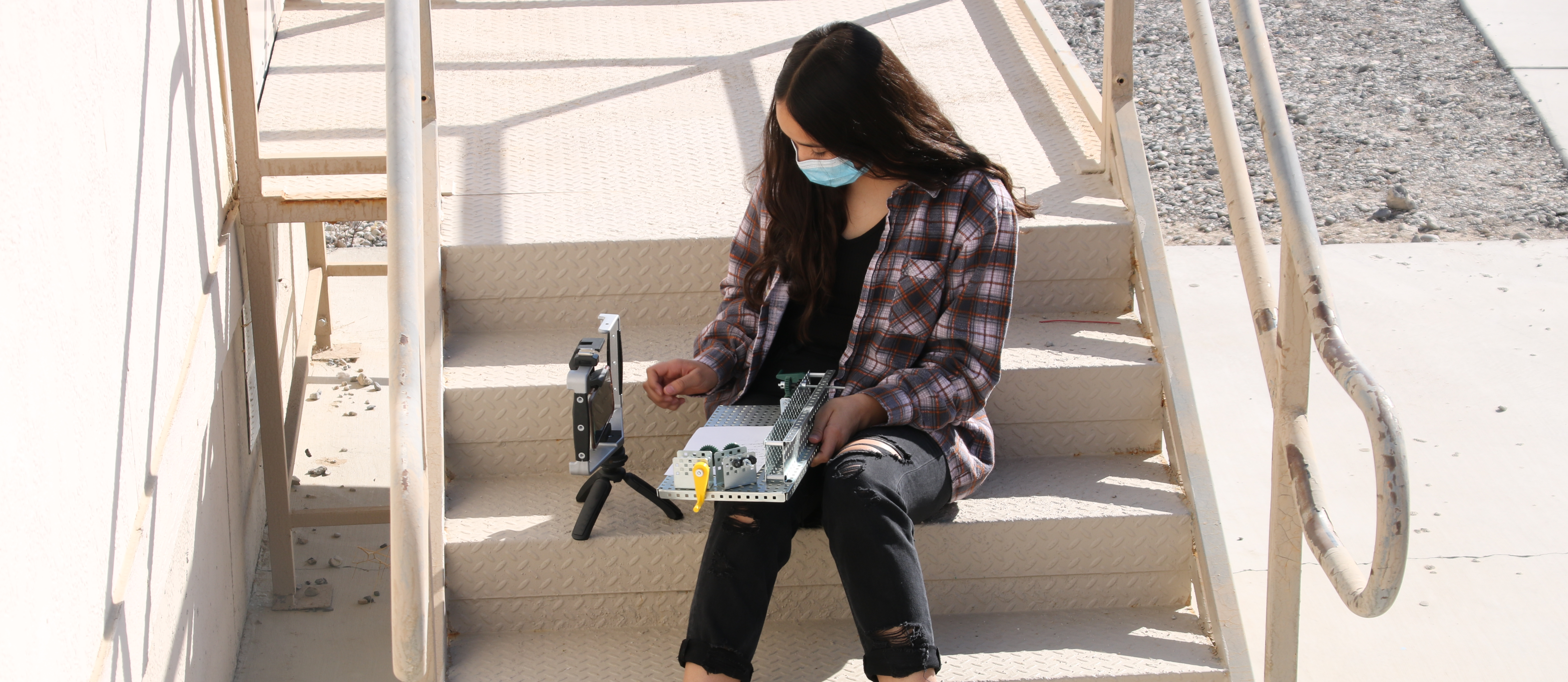Valerie T. working on documenting her mechanisms project in 8th-grade STEAM