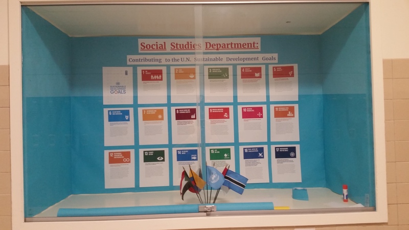 A photo of an exhibit with a title that says "Social Studies Department: Contributing to the U.N. Sustainable Development Goals"