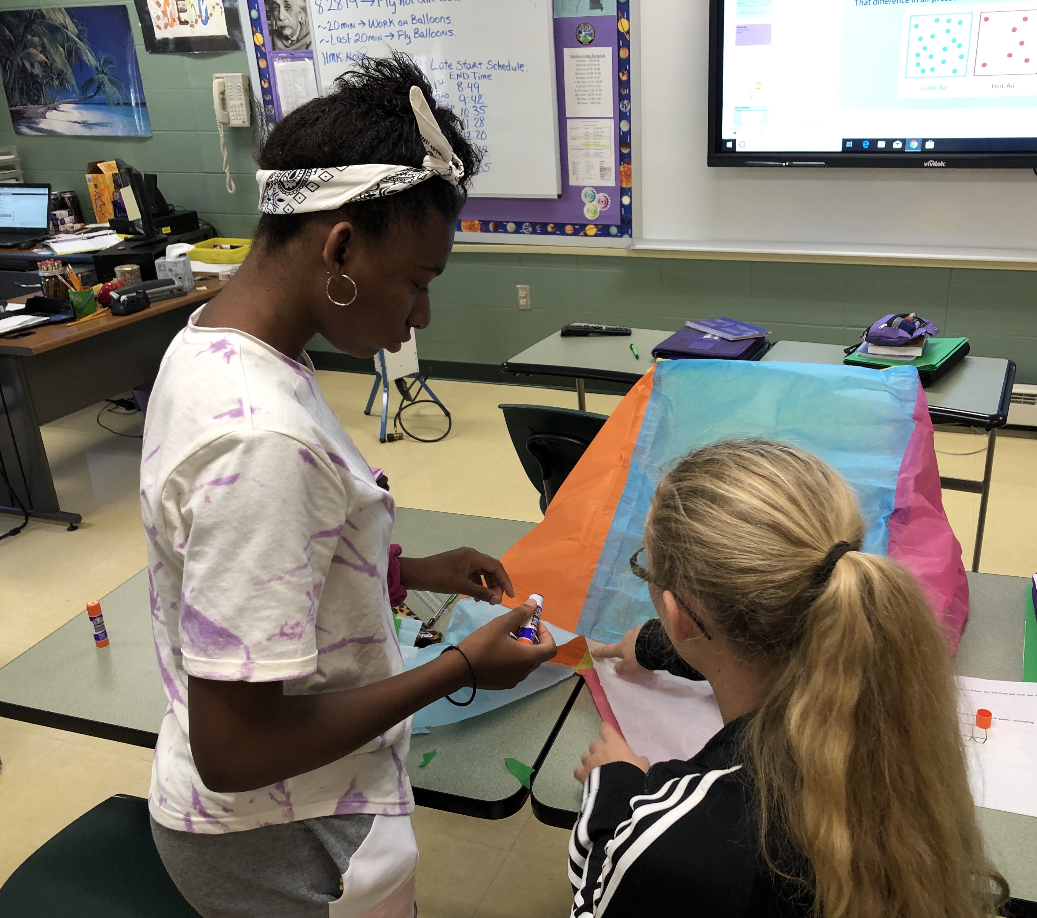 Two students working together in class