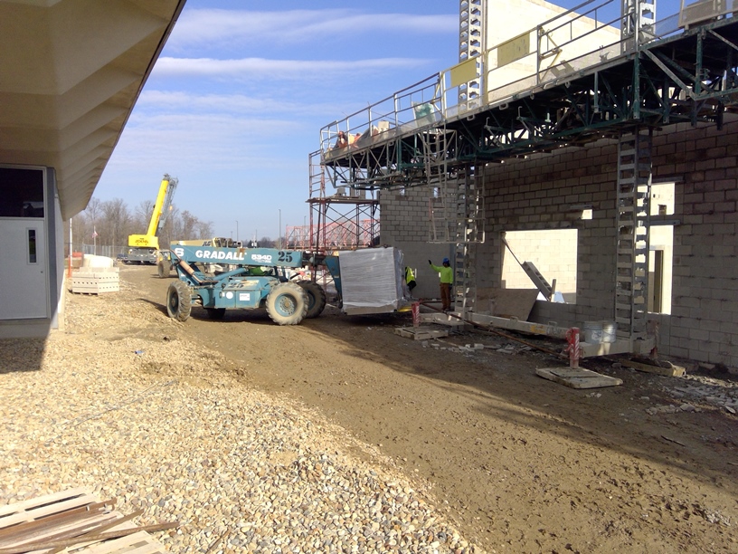 Photo of One of two air handlers being delivered and housed in the mechanical room.