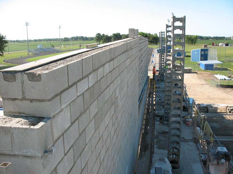 Photo of the West wall of the new gym on the scaffolding.