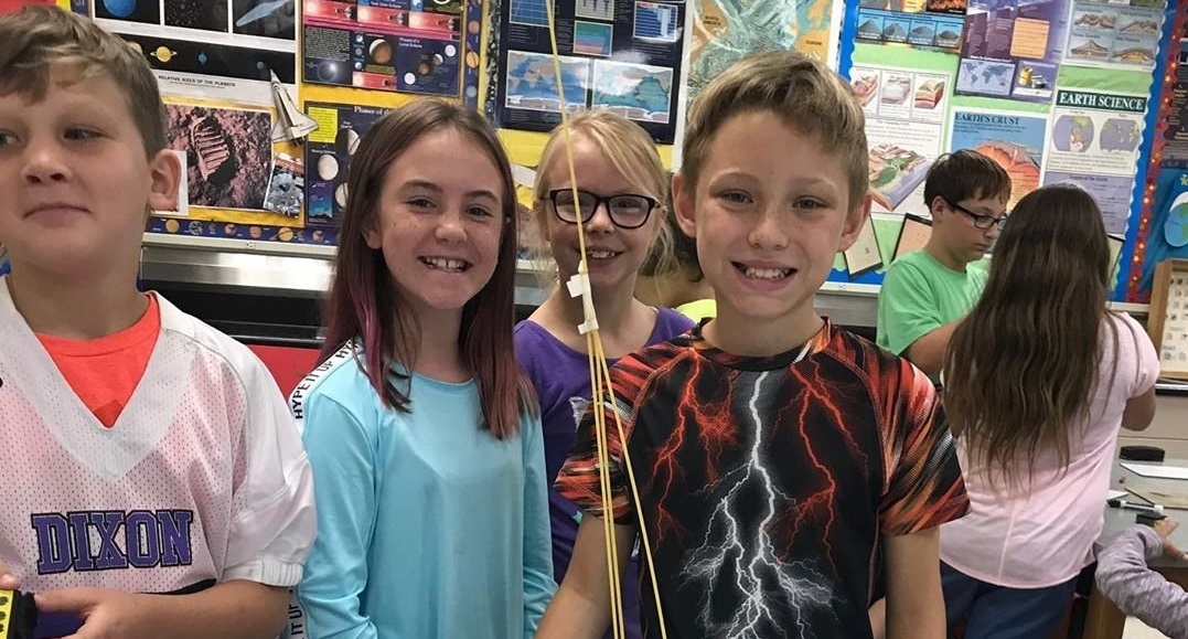 Photo of RMS students and their creation