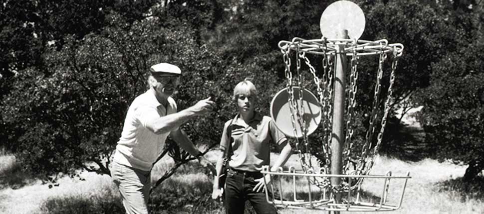 A Black and White photo of two people playing the sport