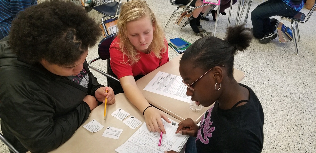 photo of 7th graders working on a project