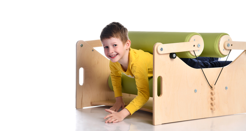 smiling boy in exercise set for persons with locomotor disorder