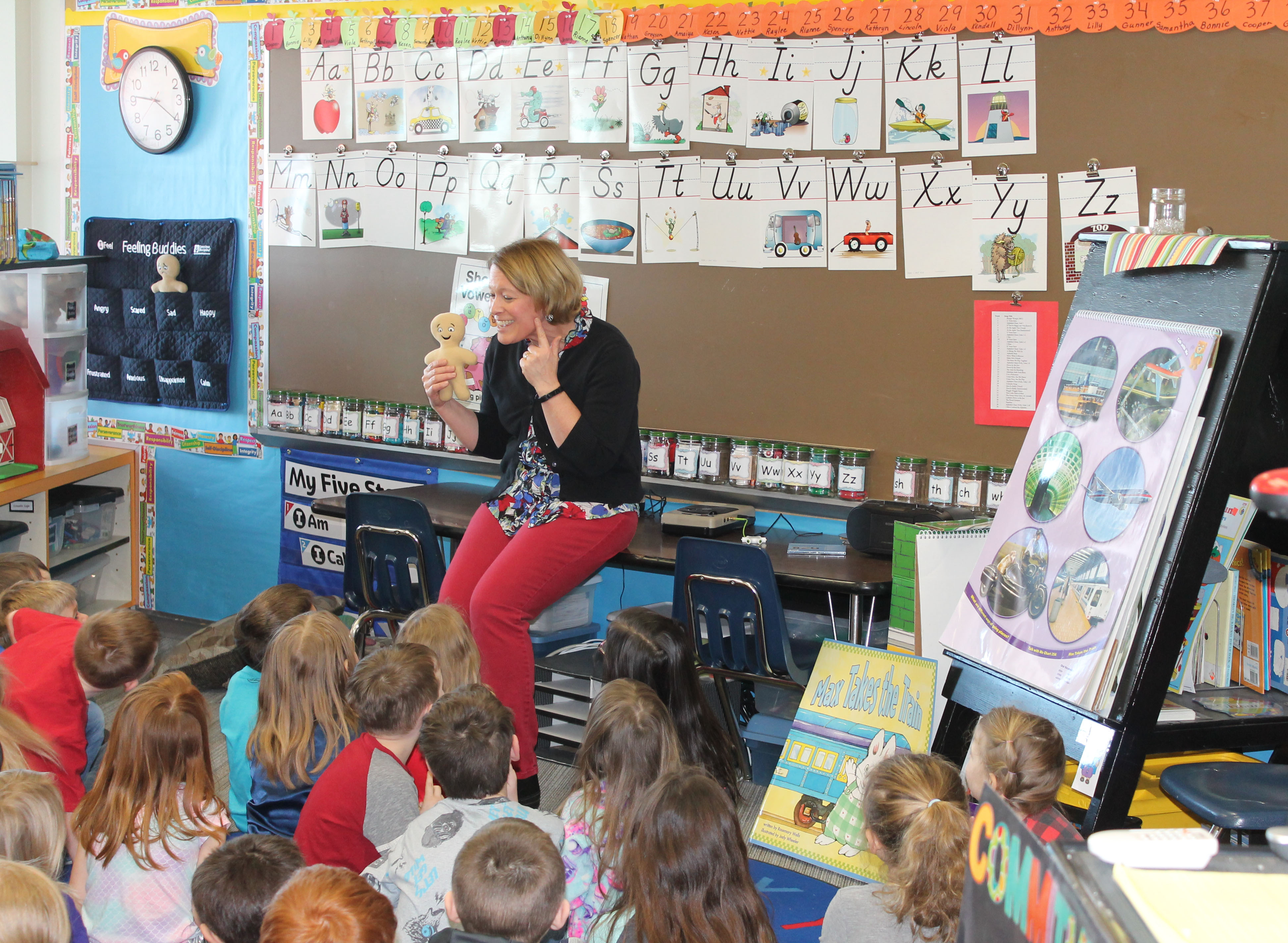 A photo of a teacher in a classroom.