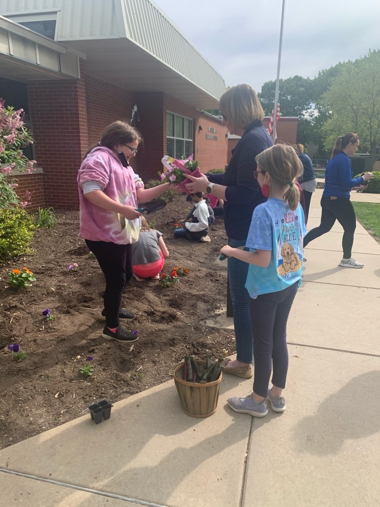 Students planting flowers