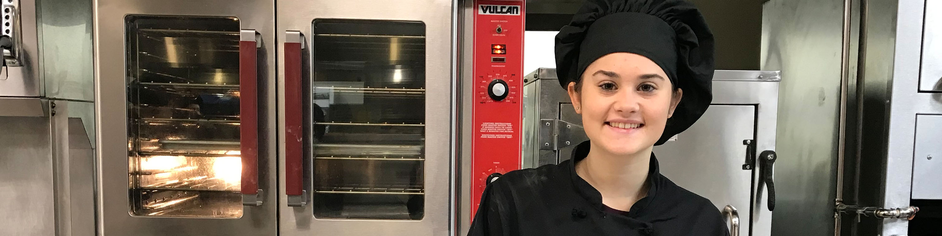 Culinary Arts Student standing in the kitchen