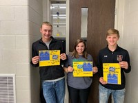 Three students holding certificates