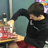 Member gluing coke cans together