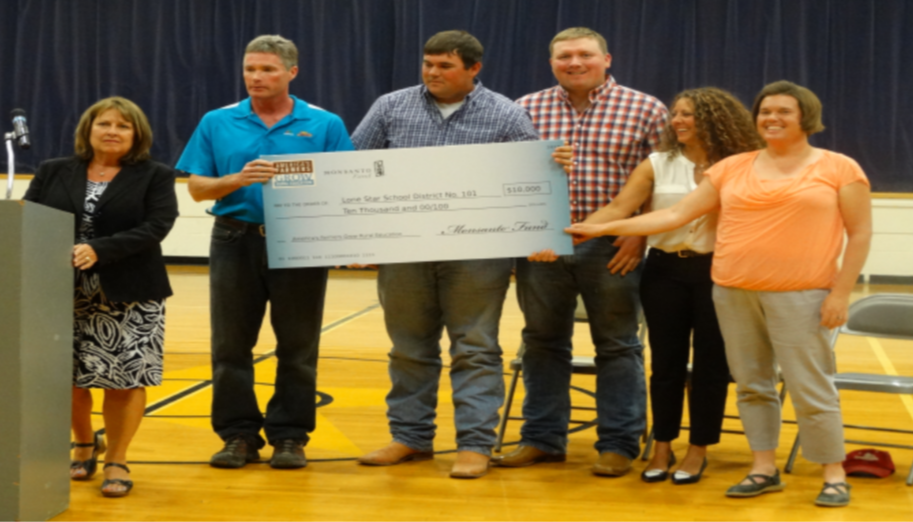 school being presented with a check