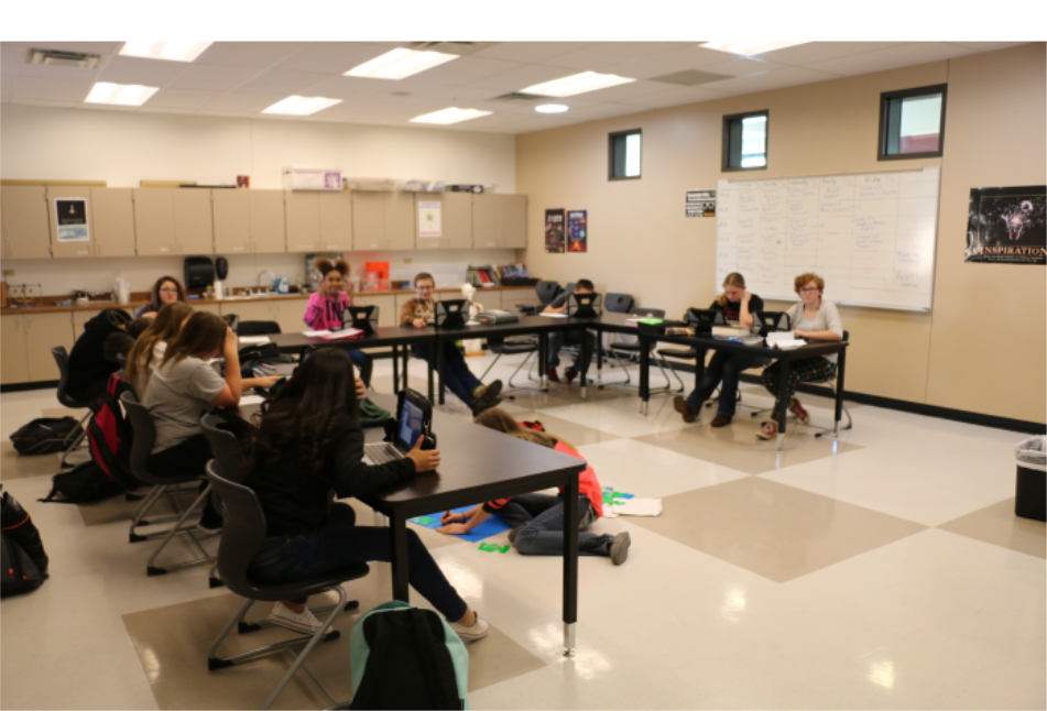 a classroom with kids taking notes