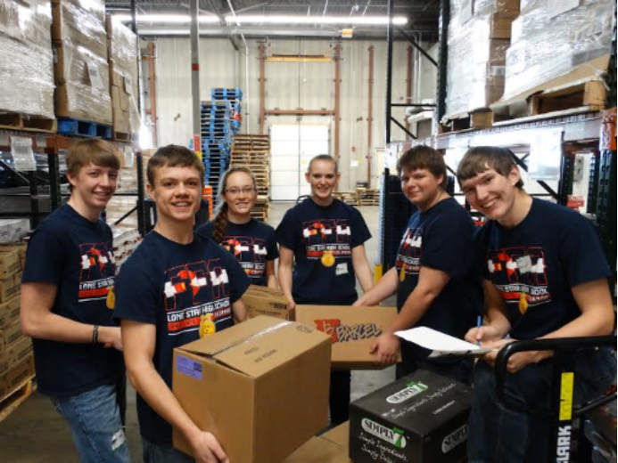 kids in a storage factory moving boxes