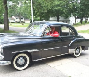 Principal in his car