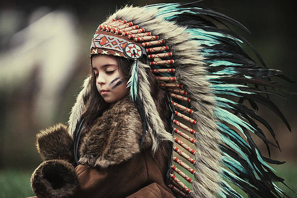 Child wearing a headdress