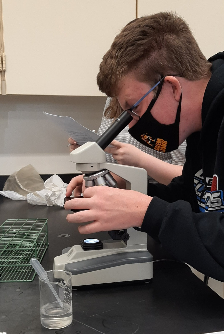 Student with Microscope