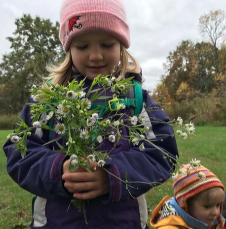 child holding flowers