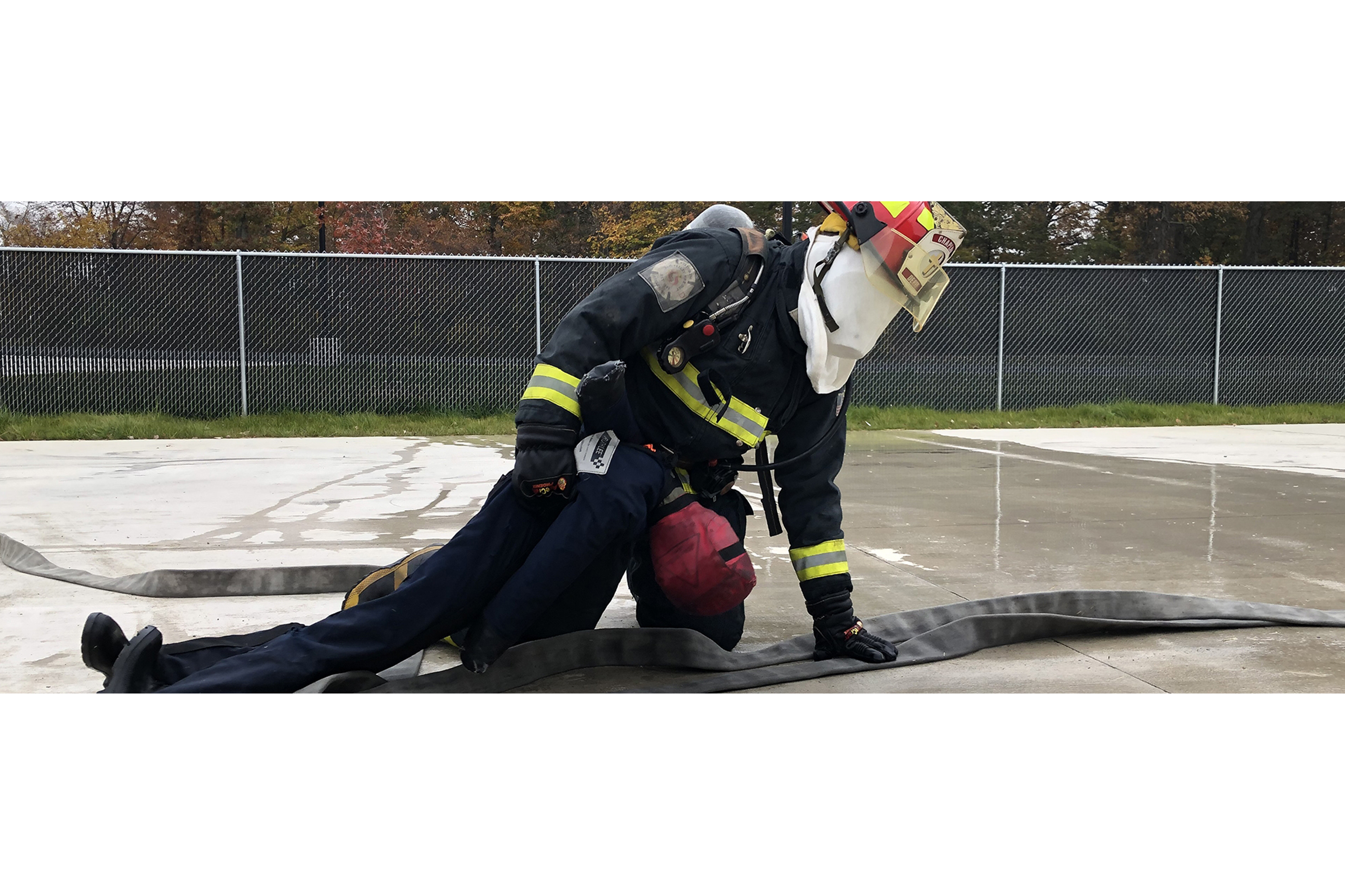 student fire fighter practicing rescues