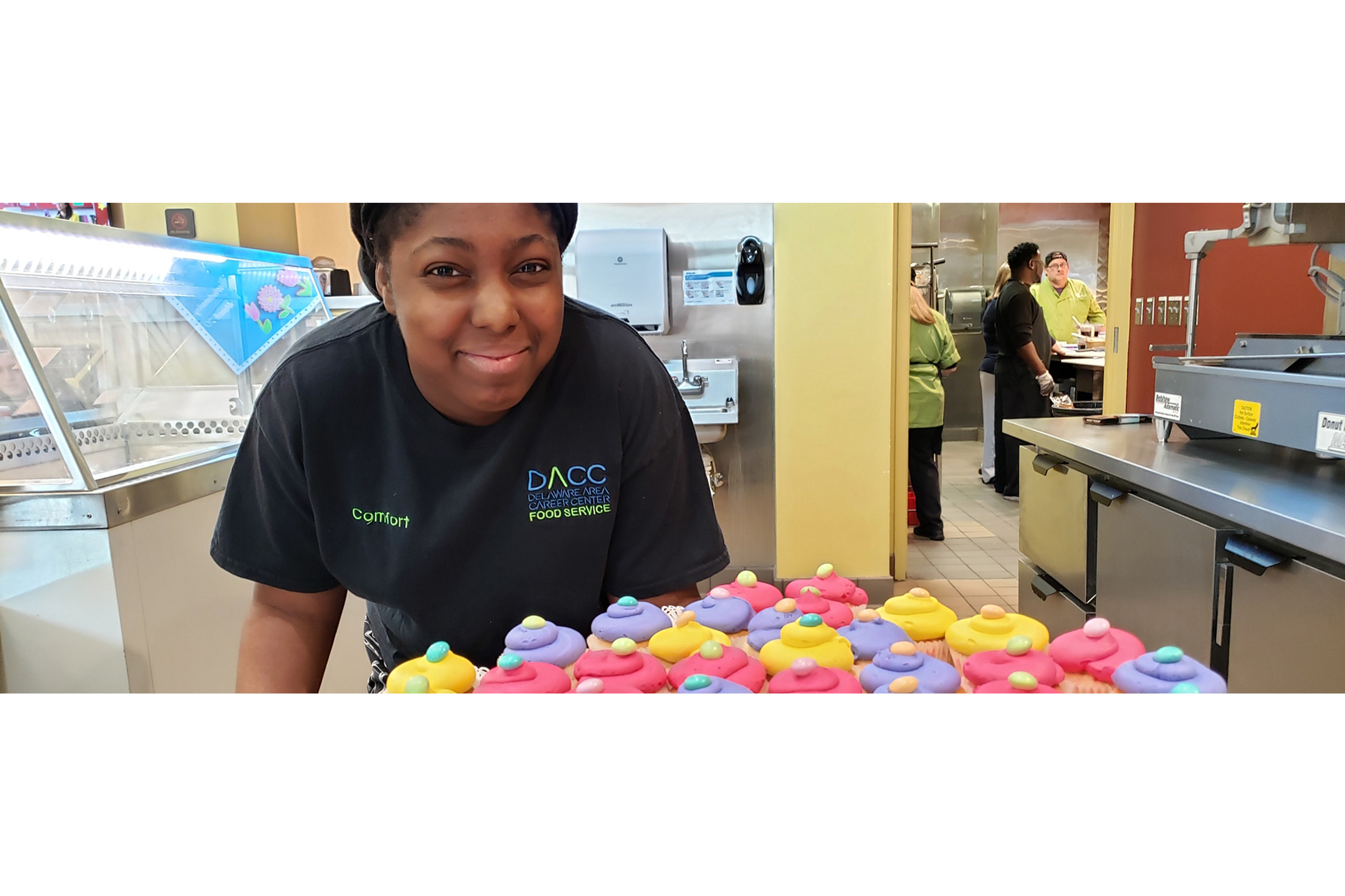 Food Service Student with Cupcakes