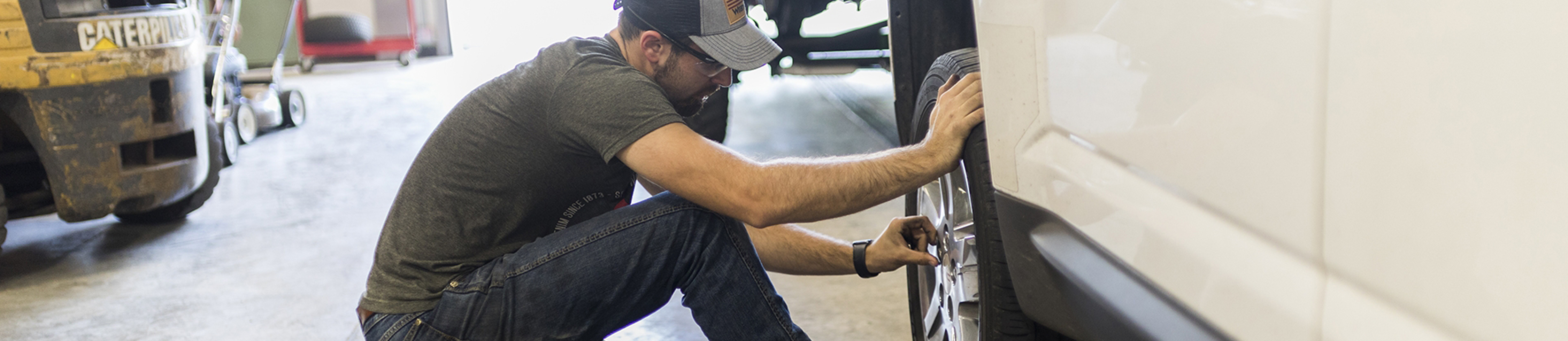 Student changing a tire