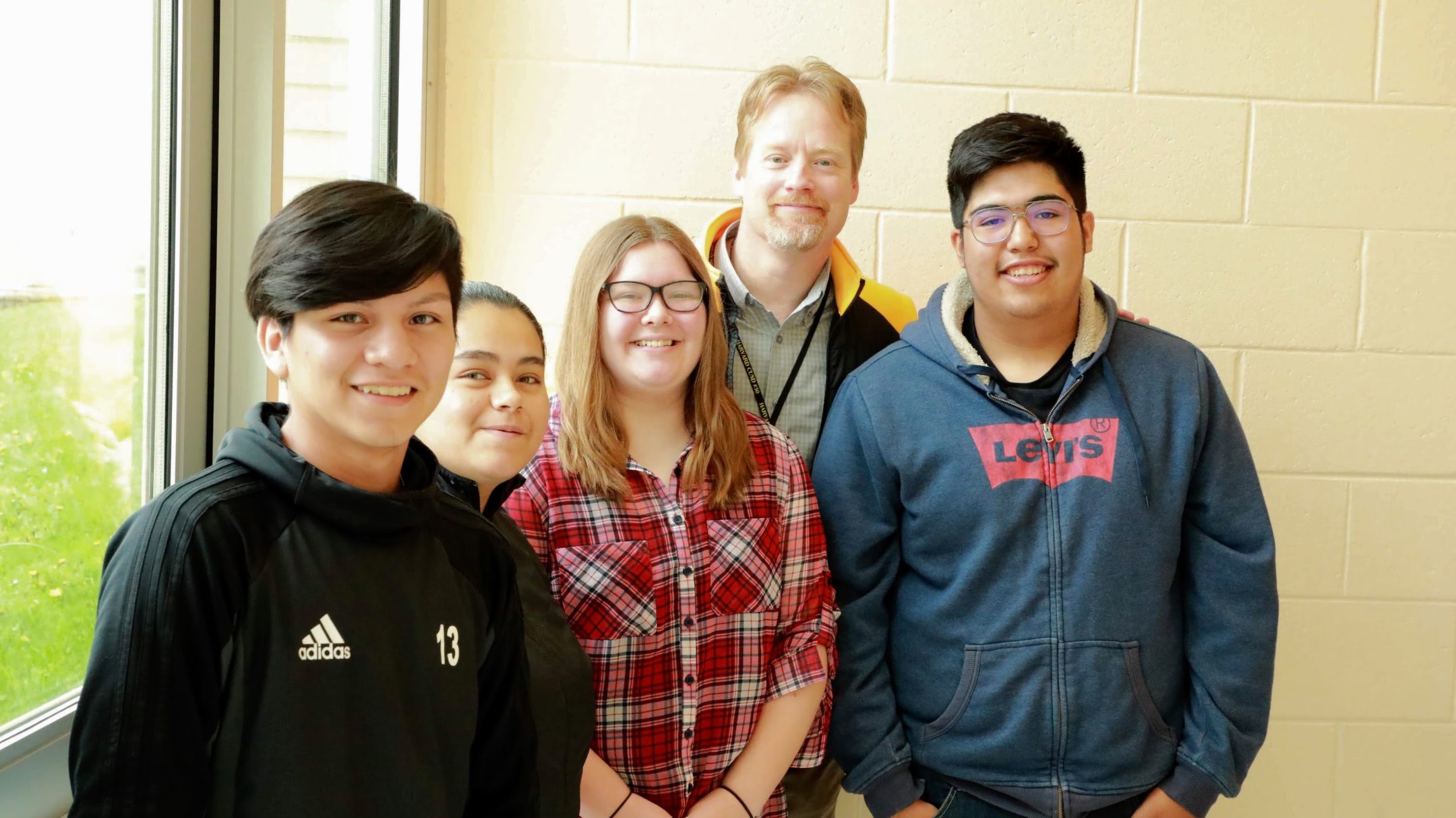 Mr. Hobbs with students at Harvard High School.