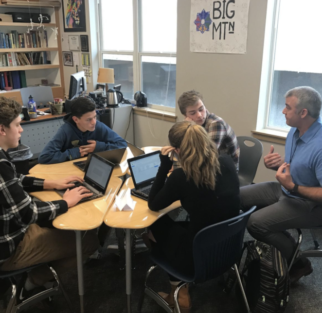 Four students working with a Writing Coach