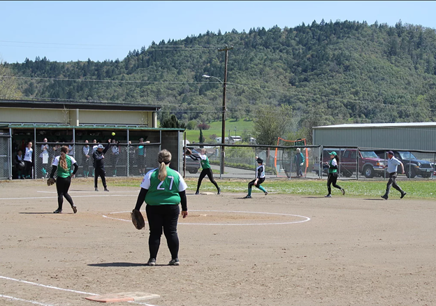 Riddle softball player tags someone out at base