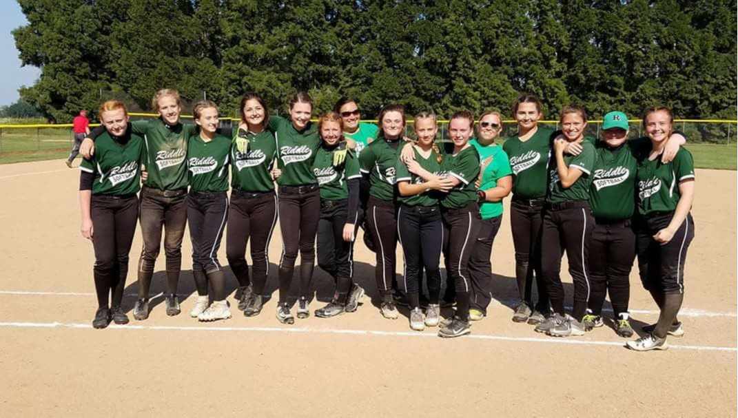 Softball team with coaches